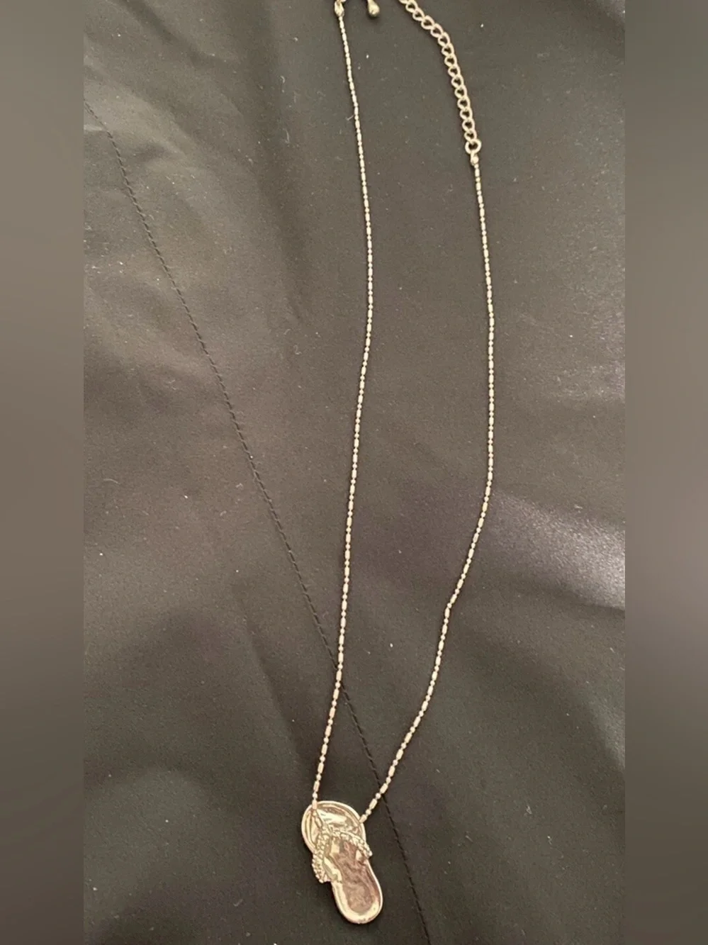 Coach pendant flip